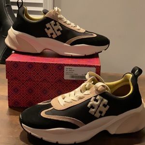 Black and cream Tory Burch sneakers